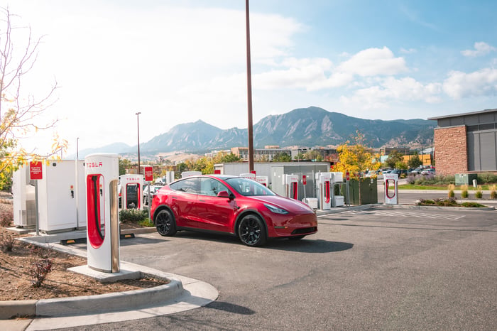 Tesla charging at a Supercharger.