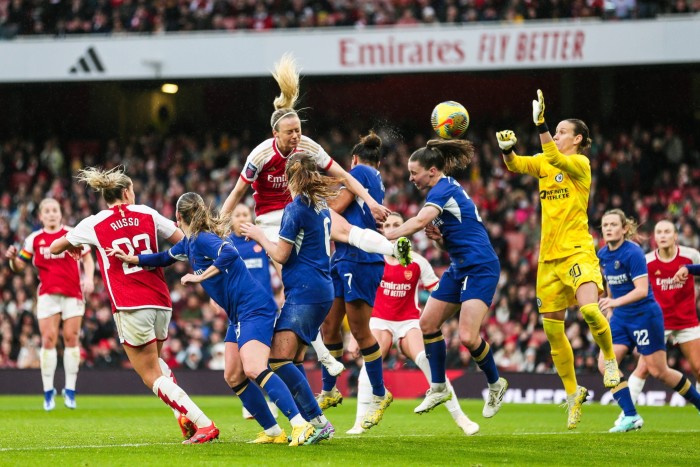 Players compete for a cross during the Arsenal vs Chelsea match in December