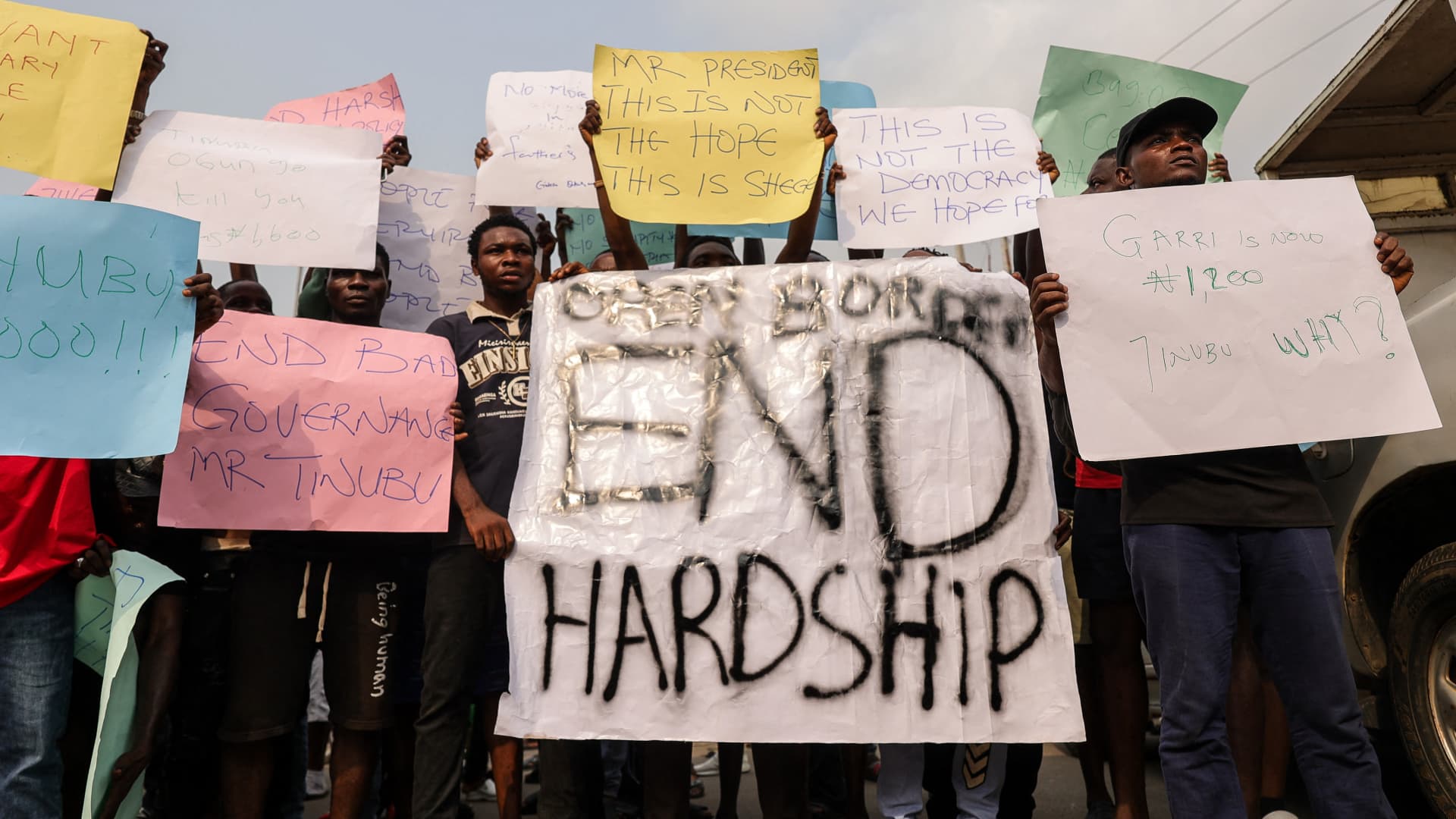 IBADAN, Nigeria - Feb. 19, 2024: Demonstrators hold placards during a protest against the hike in price and hard living conditions in Ibadan on February 19, 2024.