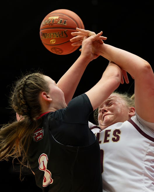 Silver Lake's Makenzie McDaniel (10) reaches for the ball against Hesston's Kendal Brueggen (3) during State Basketball Championships March. 9, 2024 at Hutchinson Sports Arena.