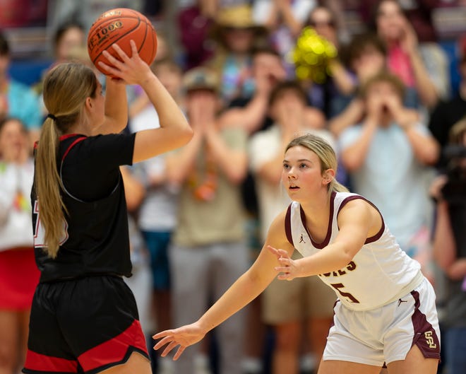 Silver Lake's Kaylee Deiter (5) defends against Hesston's Abby Proctor (15) during State Basketball Championships March. 9, 2024 at Hutchinson Sports Arena.