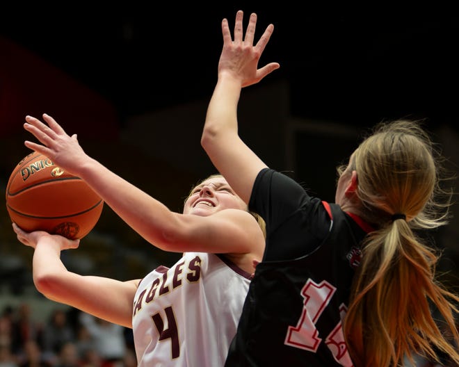 Silver Lake's Kailyn Hanni (4) shoots the ball against Hesston's Abby Proctor (15) during State Basketball Championships March. 9, 2024 at Hutchinson Sports Arena.