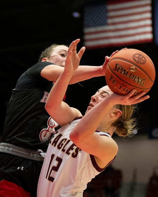 Silver Lake's Mckinley Kruger (12) shoots the ball against Hesston's Kendal Brueggen (3) during State Basketball Championships March. 9, 2024 at Hutchinson Sports Arena.