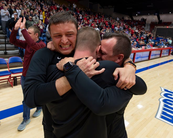Silver Lake's coaches hug after defeating Hesston during State Basketball Championships March. 9, 2024 at Hutchinson Sports Arena.