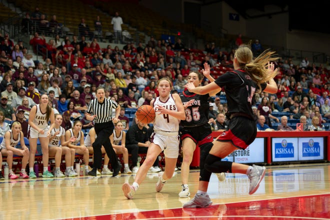 Silver Lake's Kailyn Hanni (4) dribbles to the basket during State Basketball Championships March. 9, 2024 at Hutchinson Sports Arena.