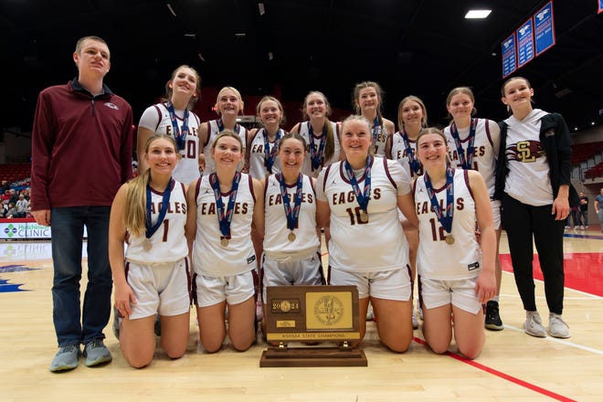 Silver Lake poses for pictures after the game during State Basketball Championships March. 9, 2024 at Hutchinson Sports Arena.