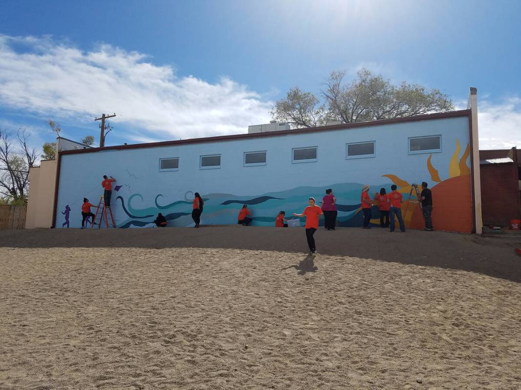 About 25 SolarReserve employees, joined by other volunteers, recently painted two murals on out ...