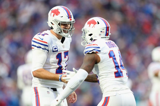 ORCHARD PARK, NEW YORK - OCTOBER 31: Josh Allen #17 and Stefon Diggs #14 of the Buffalo Bills celebrate after scoring a touchdown in the fourth quarter against the Miami Dolphins at Highmark Stadium on October 31, 2021 in Orchard Park, New York. (Photo by Joshua Bessex/Getty Images)
